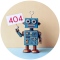 Ein kleiner Roboter hält ein Schild hoch mit der Zahl 404.